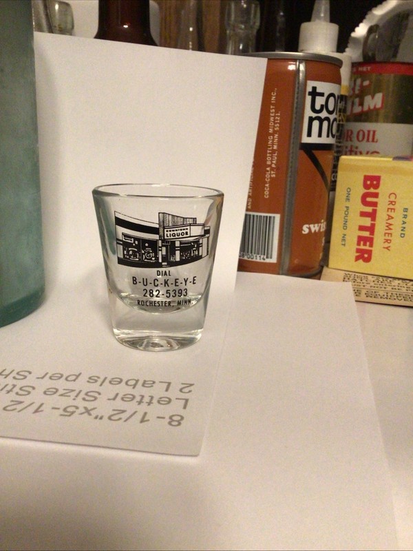 2.25” ACL SHOT GLASS BUCKEYE LIQUORS ROCHESTER MINN, 1970’s ADVERTISING OLMSTED 