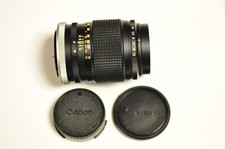 Canon FL 135mm f/3.5 manual focus telephoto lens with caps.