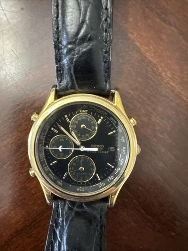 Seiko Quartz World Timer Date Alarm 5T52-6A39 38mm Gold Black Needs Battery