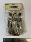  Beme Basics brand pair of bronze-finished metal curtain holdbacks — photo 1
