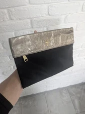 Leather and neilon prada clutch bag black and Gold color 