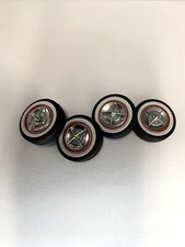 125 15 Four Bar Hub Caps On Red Ring And White Walls Tires 125 15 Four Bar Hub Caps On Red Ring And White Walls Tires