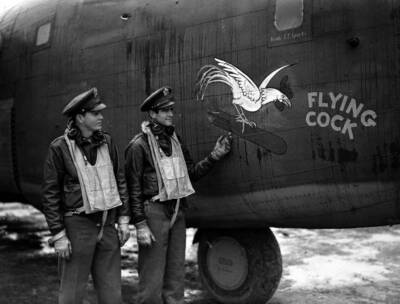 The pilot & co-pilot American Liberator bomber pose their masco- 1942 Old Photo