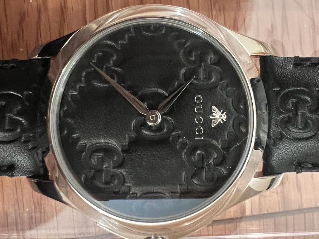 RRP £710- GUCCI G-TIMELESS SIGNATURE BLACK DIAL STAINLESS STEEL