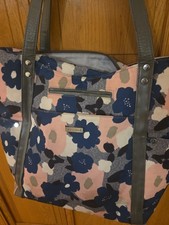 JJ Cole Bucket Tote diaper bag in a heather floral pattern.
