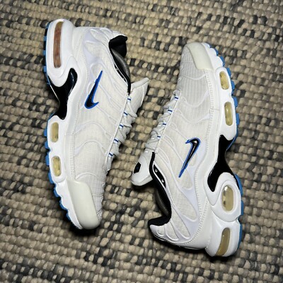 white tns with blue tick