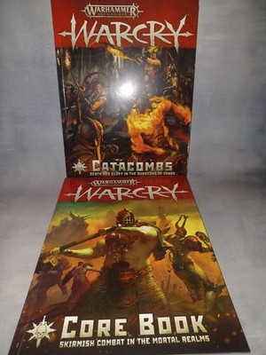 WARCRY CORE rulebook and Catacombs Expansion book.