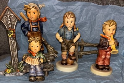 Hummels by Goebel, small collection. Four figures and Summer accessory pieces