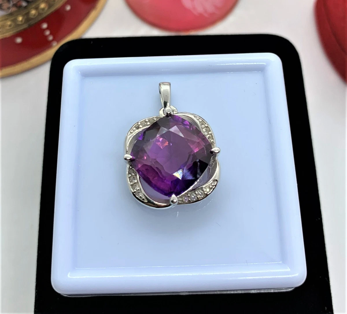 10 TCW Certified Loupe Clean Color Changing Taaffeite in Rhodium