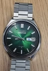 vintage Seiko 5 Actus SS automatic watch with a green dial