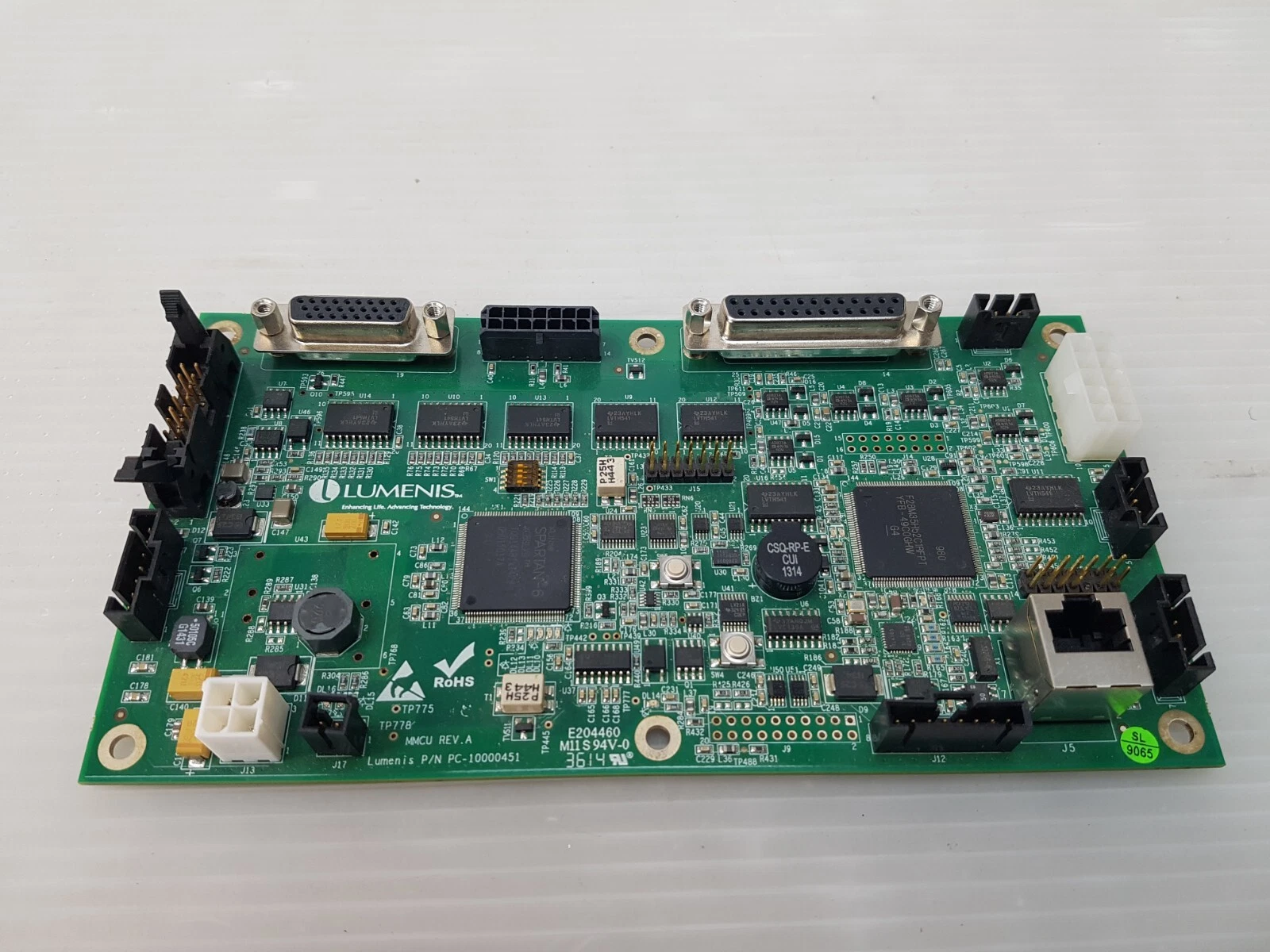 Lumenis MMCU board PC-10000451 Rev A seen at an angle from the connector edge