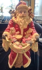 VINTAGE 10" SANTA FIGURINE CARRYING A BAG OF TOYS
