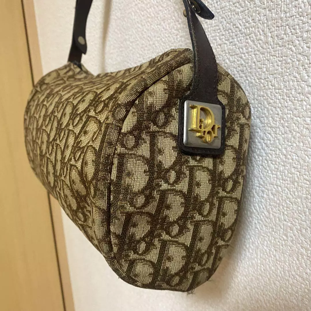 Sac à main Christian Dior motif trotteur occasion poignée fermeture éclair légèrement usée