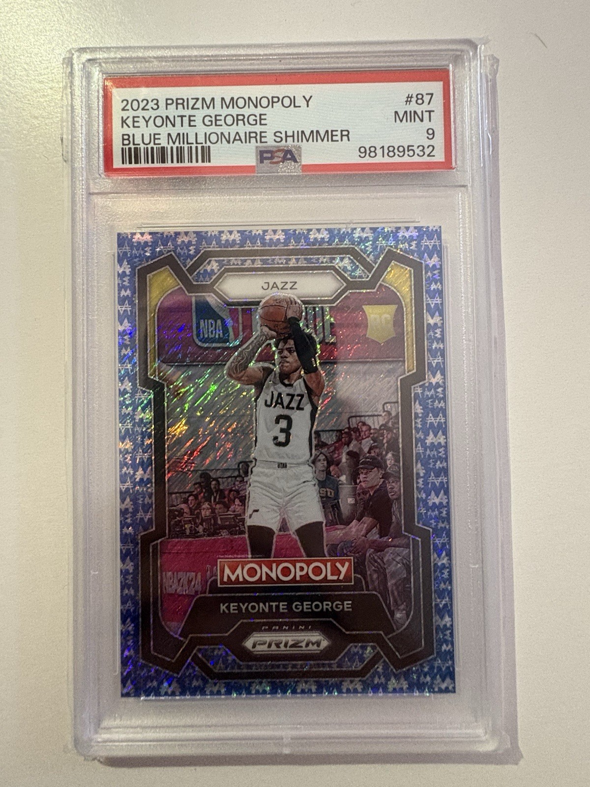 2023 PRIZM MONOPOLY KEYONTE GEORGE BLUE MILLIONAIRE SHIMMER /10 RC
