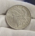 1887 O US Morgan Silver Dollar $1 XF + (Cleaned)