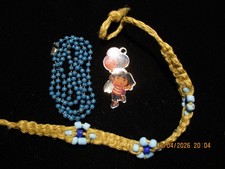 Macrame flower bracelet and Dora the Explorer necklace