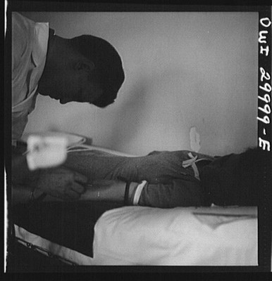 1981 Man Receiving Medical Treatment Hospital Bed Black and White Photo
