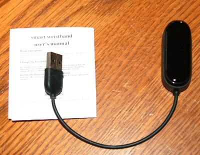 Xiaomi Mi Fit Smart Band fitness tracker with charger