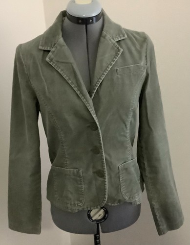 beige jacket blue trousers