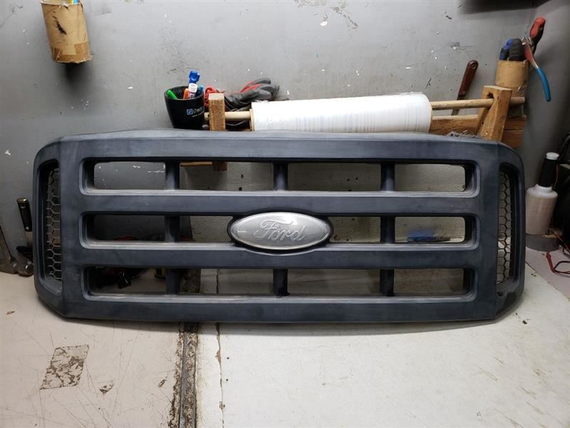 Grille Black Surround Textured Finish Fits 06-07 FORD F250SD PICKUP 1093693
