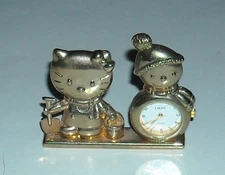 HELLO KITTY & SNOWMAN GOLD PLATED MINIATURE CLOCK w STAINLESS BACK NOVELTY