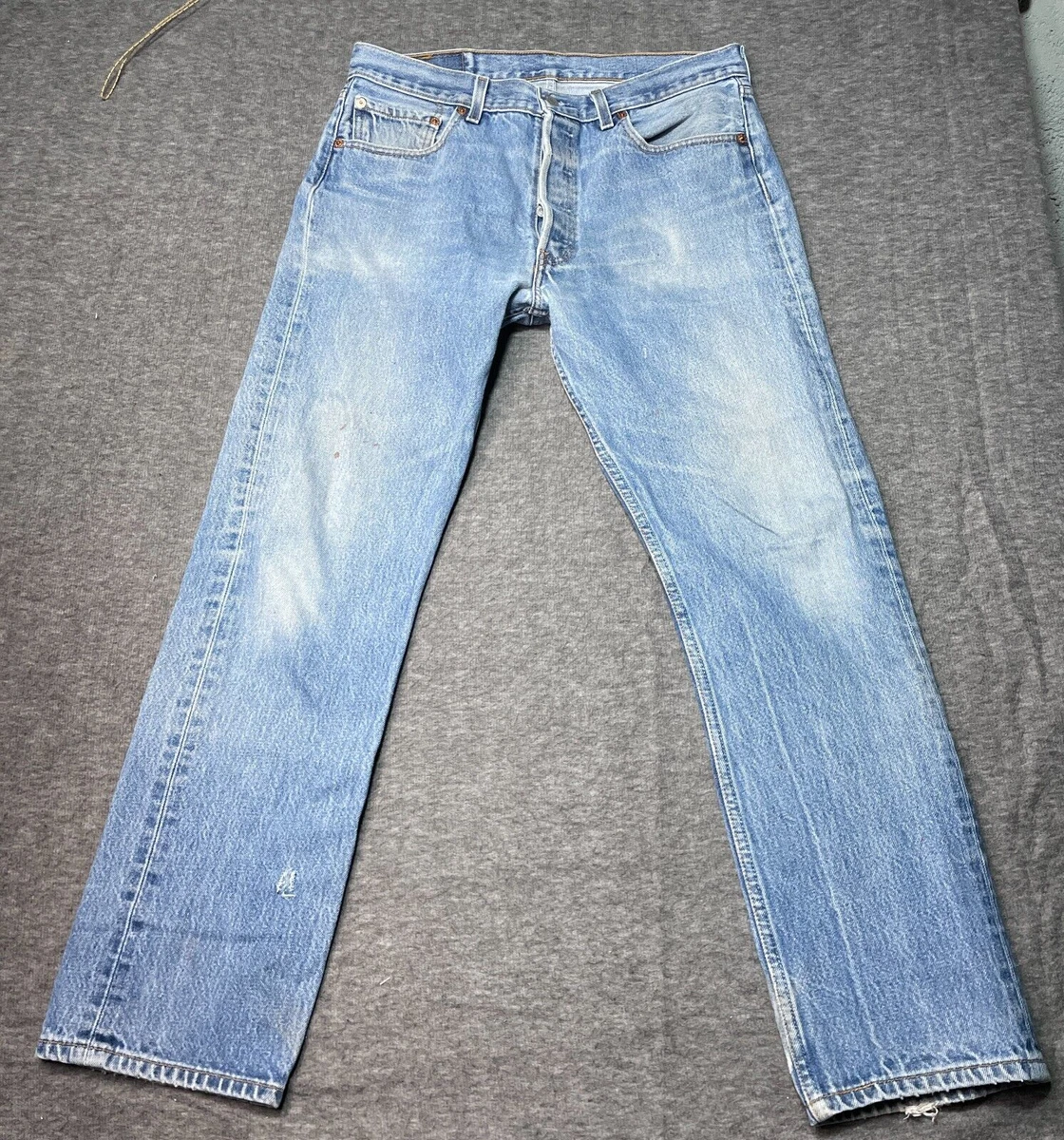 Vintage Levis 501 button fly XX distressed torn hard worn jeans