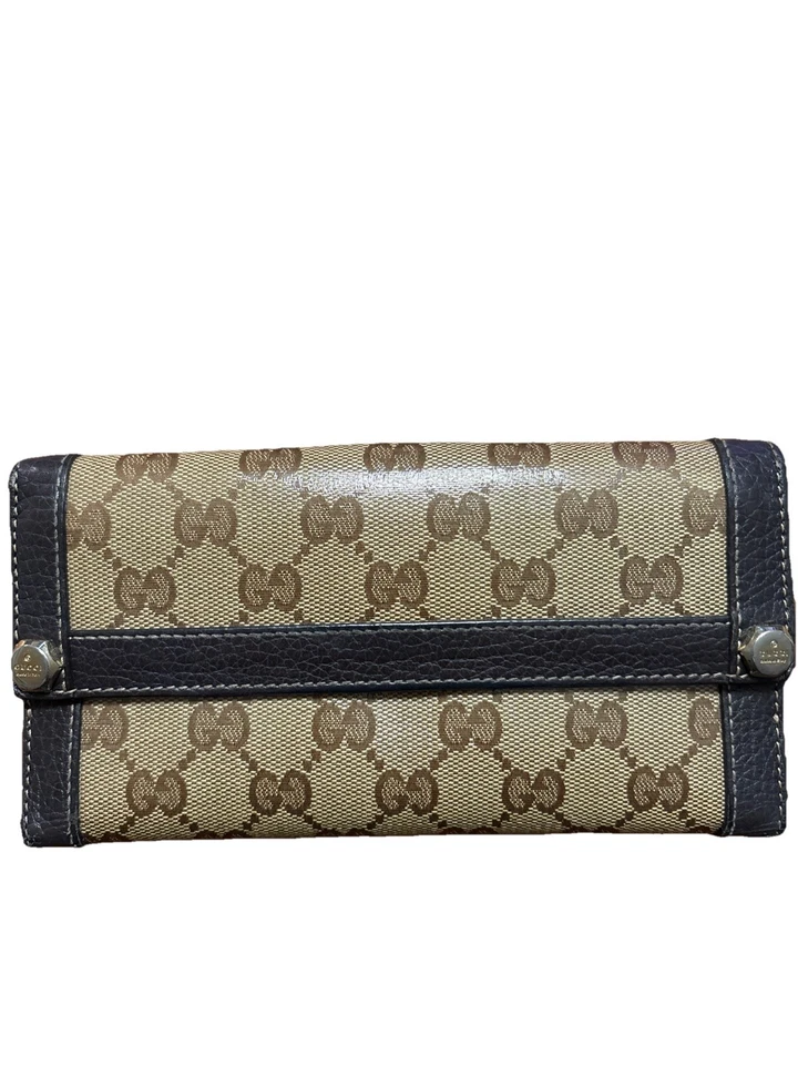 Cartera larga Gucci GG monograma lona con ribete de cuero. Foto 3 de 4