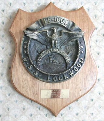FF-1064 U.S.S. LOCKWOOD ''SECURE AGAINST THE WAVES'' BRASS PLAQUE ON WOOD