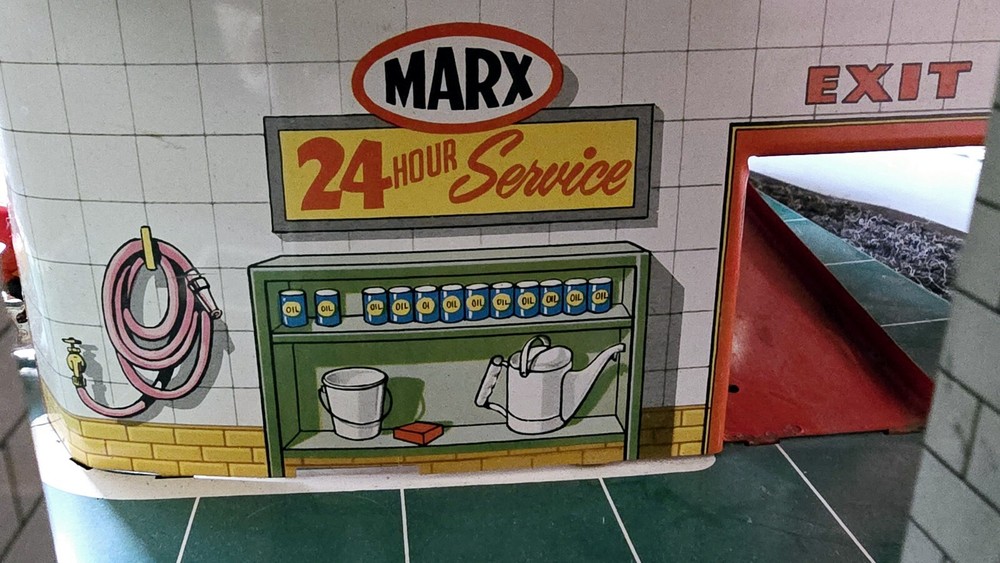 Marx Service Station Motorcycle , And Two Marx Wind Up Race Cars