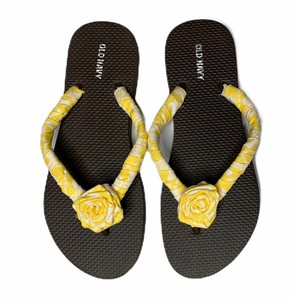 white fabric flip flops