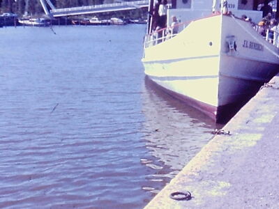 Vintage found 16MM Slide Photo Boat Docked Beside Calm Waters on Sunny Day