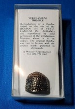 REPRODUCTION VERULAMIUM THIMBLE BY WESTAIR IN DISPLAY CASE.