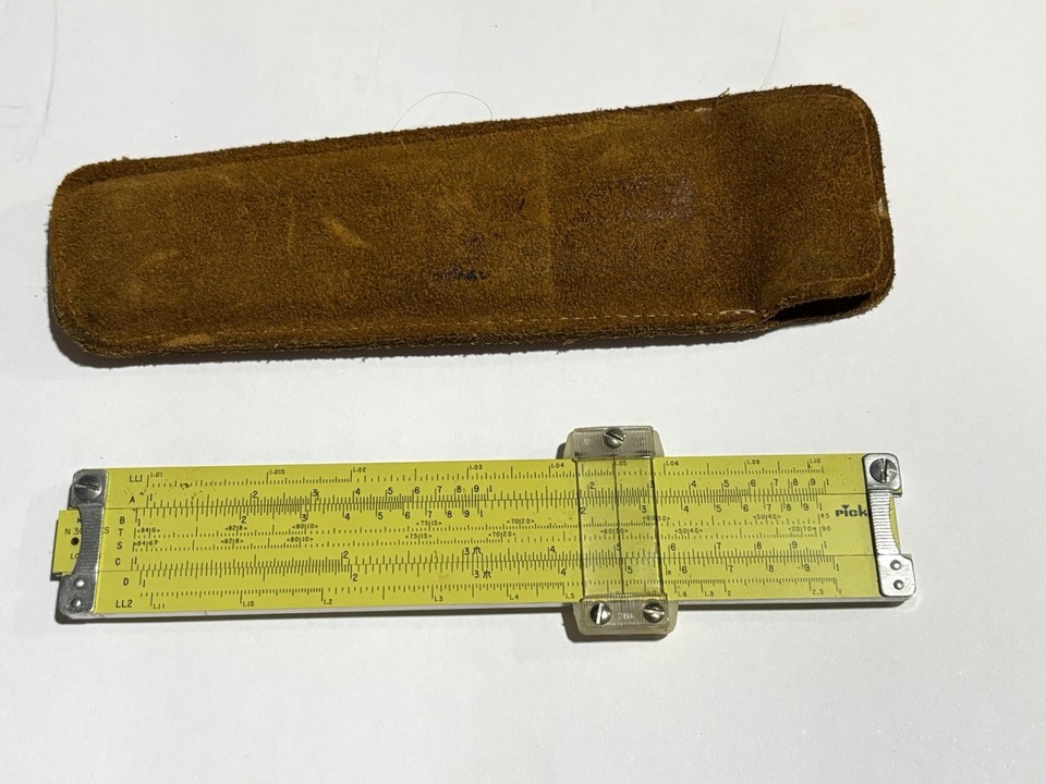 A Pickett N300-ES Log slide rule in its original leather case — a beautifully tactile pre-digital computing artifact that still actually works.