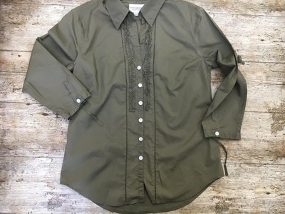 green ruffle shirt
