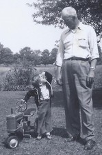 1955 SNAPSHOT PHOTO GRANDPA  GRANDSON WITH PEDAL TOY TRACTOR