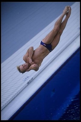 Kent Ferguson USA is captured in mid dive performing a full body t- Old Photo