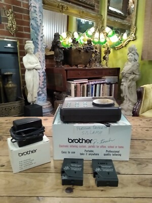 BROTHER P-TOUCH ELECTRONIC LETTERING SYSTEM WITH AC ADAPTER & (2) TAPE LABELS