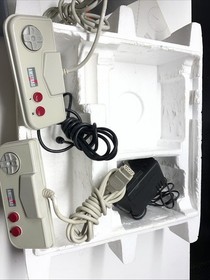 Consola Amstrad GX4000 en caja con 32 carro de juegos