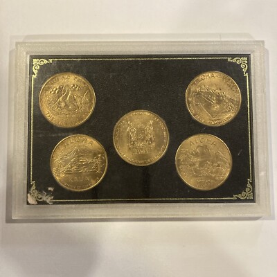 COINS OF HAWAII FIVE TOKEN DOLLAR SET IN ORIGINAL FRAME AND SLEEVE
