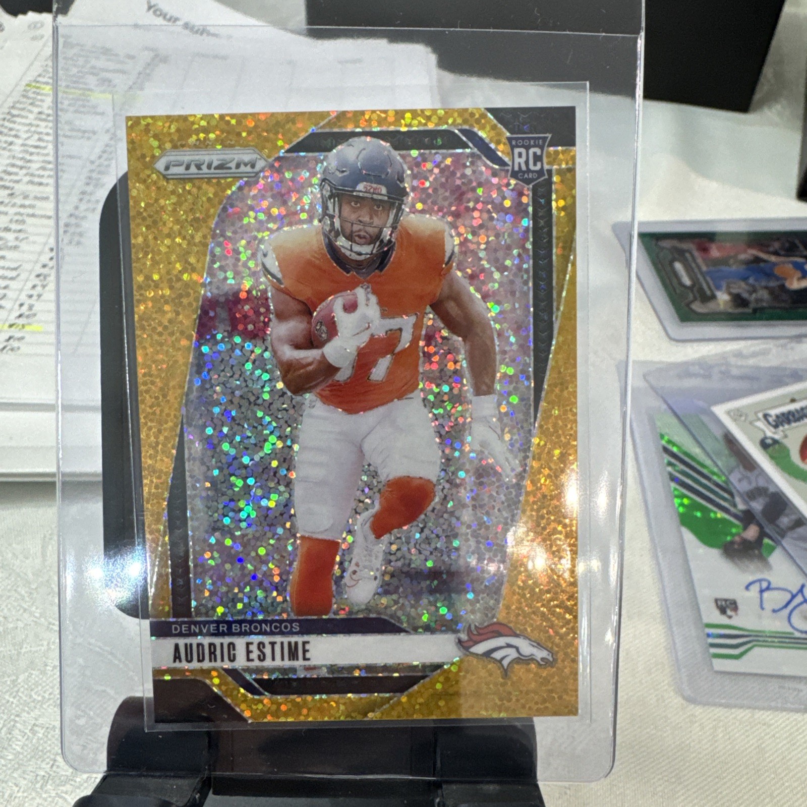 2024 Panini Prizm Rookies Audric Estime #306 Gold Sparkle Prizm /24 (RC)