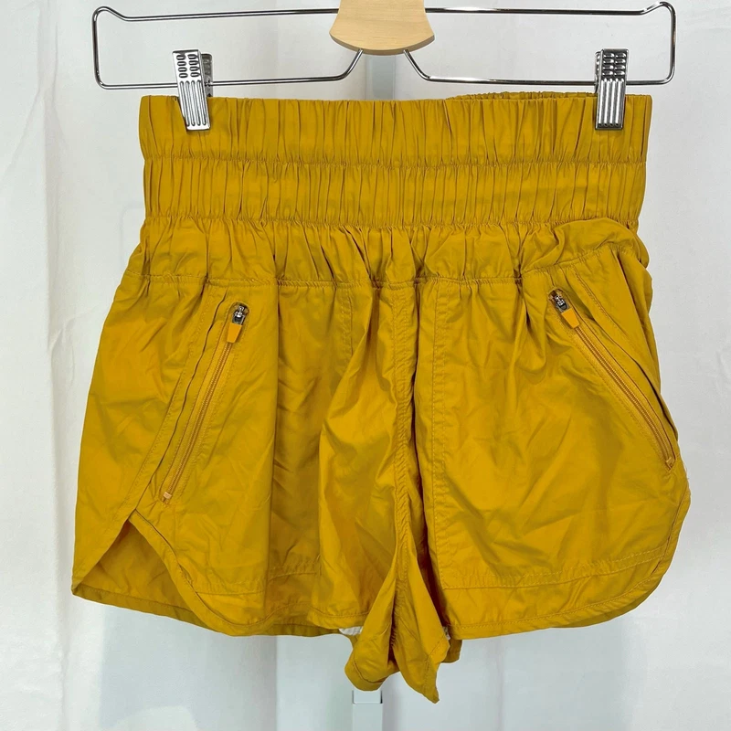 free-people-movement the way home smocked waist gold shorts