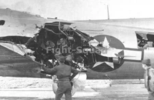 WW2 Picture Photo US Crew B-17 bomber inspects damage to his plane  3657