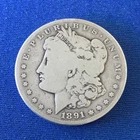 1891-S Morgan Silver Dollar having G+ details.