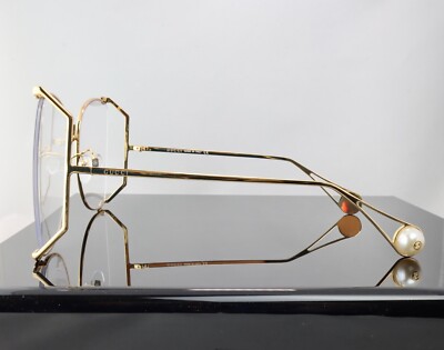 Gucci GG0252S Gold / Clear Lens Butterfly Oversized Women