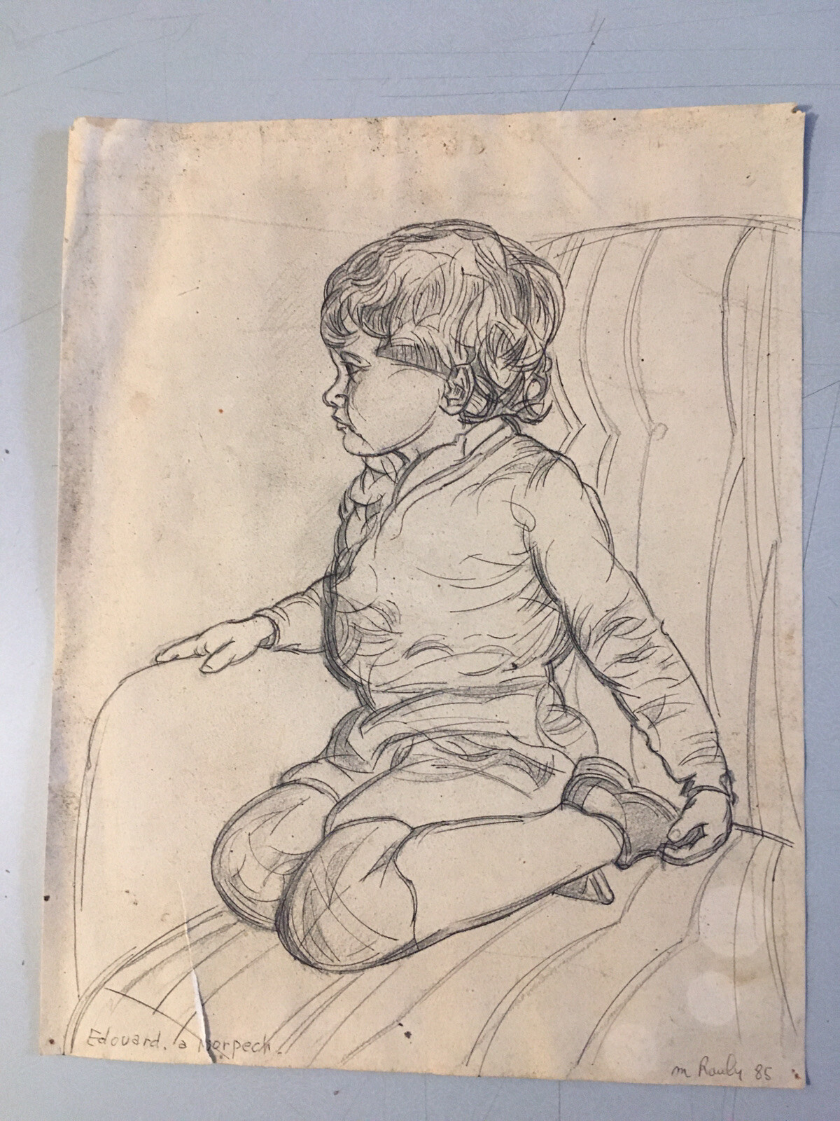 Beautiful drawing portrait child boy armchair on pencil paper Michel Rauly
