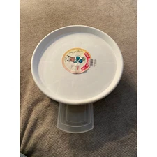 12” white plastic rolling flower pot tray with a water bin