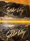 (2) Nos “Gold City“ License Plates