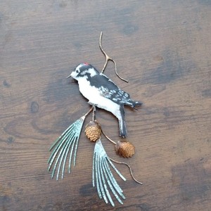 Handcrafted Metal Bird and Pine Branch Sculpture with Carvings