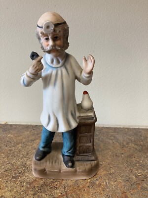 dentist figurine pulling teeth, 7.5 in, ceramic, vintage