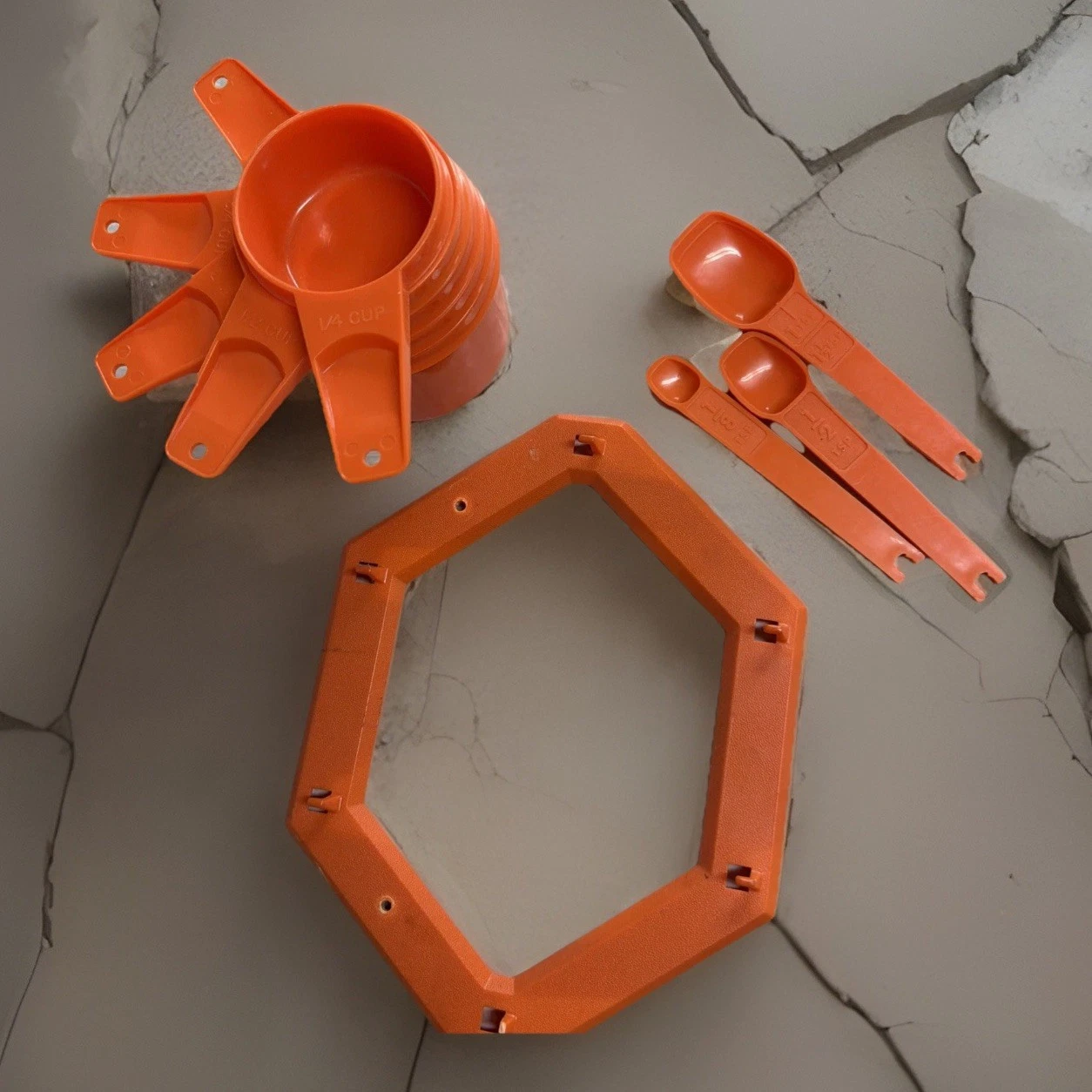Vtg Tupperware, USA Orange Measuring Cups + Wall Hanging Rack + Measuring Spoons
Opens in a new wind